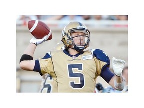 Winnipeg Blue Bombers quarterback Drew Willy attempts a pass during first quarter CFL football action against the Montreal Alouettes in Montreal on Friday, July 11, 2014.
