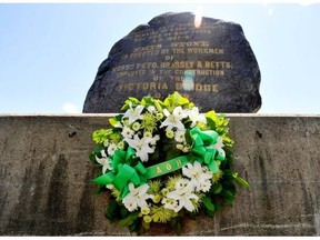 A wreath sits at the base of the black rock in Point-Saint-Charles, Montreal, Sunday, May 31, 2009, after a ceremony to commemorate the Irish immigrants who died of typhus in Montreal after fleeing the potato famine in 1847.