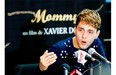 Xavier Dolan talks about winning the Jury Prize at Cannes Film Festival for Mommy at a news conference in May.