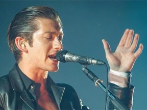 Alex Turner of the English indie rock band Arctic Monkeys performs with his group for 2014 Osheaga Music Festival at Jean-Drapeau Park in Montreal on Sunday, August 3, 2014.