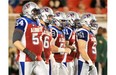 The Alouettes offensive line, from left, Jeff Perrett, Ryan Bomben, Luc Brodeur-Jourdain, Ryan White and Krisian Matte, approaches the line of scrimmage during Canadian Football League game against the Edmonton Eskimos in Montreal Friday August 08, 2014.