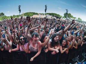 Music fans enjoy the performance by American rapper Childish Gambino on the first day of the 2014 Osheaga Music Festival at Jean-Drapeau Park in Montreal on Friday, August 1, 2014. (Dario Ayala / THE GAZETTE)