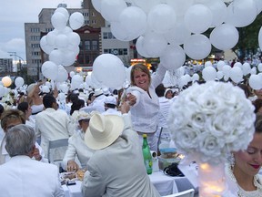 White balloons were given to the participants  during the Annual Diner en Blanc which took place Thursday August 14, 2014 in the evening with more than 5,000 people dressed in whites gathering at Place des Festivals in Montreal to picnic in elegant fashion and celebrate life in the city. (Marie-France Coallier/ THE GAZETTE)