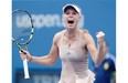 Caroline Wozniacki of Denmark reacts after defeating Maria Sharapova of Russia during the fourth round of the 2014 U.S. Open tennis tournament Sunday in New York.