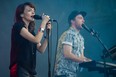 Lauren Mayberry, left, and Martin Doherty, right, of the Scottish electronic band CHVRCHES perform with the group for the 2014 Osheaga Music Festival at Jean-Drapeau Park in Montreal on Sunday, August 3, 2014. (Dario Ayala / THE GAZETTE)