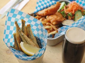 A a cone of smelts, a fish and chip meal and a Guinness at La Queue du Poisson in the Verdun area of Montreal, on Thursday, July 24, 2014. The restaurant also has a fresh seafood counter.