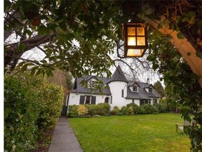 The Victoria, B.C. home is listed on the heritage registry and has a conical-roofed, two-storey tower, narrow leaded windows and gabled dormers.
