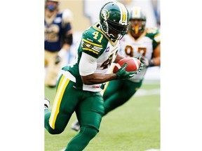 Edmonton Eskimos' Odell Willis (41) intercepts and runs the ball in for the touchdown against the Winnipeg Blue Bombers during the first half of CFL action in Winnipeg Thursday, July 17, 2014. THE CANADIAN PRESS/John Woods ORG XMIT: JGW103