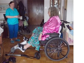 “Five months without physiotherapy is unacceptable,” says Beverly Spanier, using an active-passive trainer in her Montreal home under the supervision of caregiver Maureen Brenie.