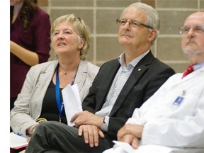 Former Canadian astronaut and federal Liberal MP Marc Garneau is flanked by Dr. John Hughes, co-principal investigator, medical informatics at St. Mary’s Hospital Centre, and Dr. Susan Law, vice-president of academic affairs at St. Mary’s Hospital, during a news conference on Wednesday announcing the creation of software that can help diagnose illnesses remotely.