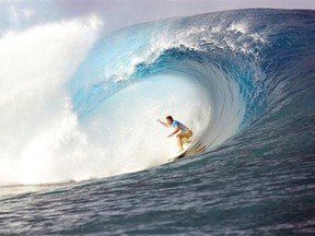 France's Michel Bourez rides a wave during the finale of the 14th edition of the Billabong Pro Tahiti surf event, part of the ASP (Association of Surfing Professionals) world tour, on August 25, 2014 in Teahupoo, on the French Polynesian island of Tahiti. Brazil's Gabriel Medina won over US Kelly Slater.