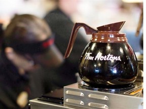 Freshly-brewed coffee sits on a hot plate in a Tim Hortons outlet in Oakville, Ont. The restaurant chain, which reported steady second-quarter profits, told investors that it anticipates earnings per share to be near the higher end — or slightly above — its current target range of $3.17 to $3.27 earnings per share for the year.