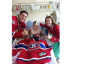 Rob Hing and his wife, Alayne, visit 13-year-old Alex Smidt, who is battling meningitis, at the Alberta Children’s Hospital in Calgary. Smidt’s story touched Habs fans on The Gazette’s hockeyinsideout.com website, resulting in Hing and his wife deciding to visit the boy from Regina they had never met and bring him some Habs goodies to help cheer him up.