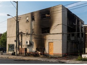 Montreal police are looking into what is described as a suspicious fire Monday night. The damaged building, in Lachine, on Tuesday, Aug. 5, 2014, is located at the corner of St Jacques St. and Ouellette St.