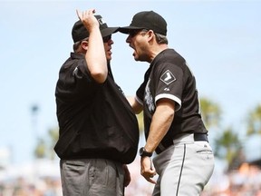 Manager Robin Ventura #23 of the Chicago White Sox is thrown out of the game for arguing with umpire Fieldin Culbreth #25 after a review of a play reversed a call that gave the San Francisco Giants a run in the bottom of the seventh inning at AT&T Park on August 13, 2014 in San Francisco, California.