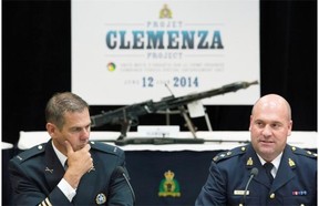 Mario Desmarais, left, with the Montreal Police Department and Michel Arcand, with the RCMP, speak to reporters during a news conference at RCMP headquarters in June, where they spoke about Project Clemenza, a major sweep of two alleged organized crime groups operating in the province.