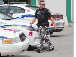 A Mascouche police officer at a police station on Friday. Mascouche’s mayor is among those suggesting the proposed Bill 3 goes too far.