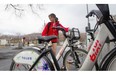 McGill student Angie Ning rents a Bixi bike at the corner of Mont Royal and Parc Aves. in Montreal, Tuesday, April 15, 2014, at the launch of the 2014 Bixi season.
