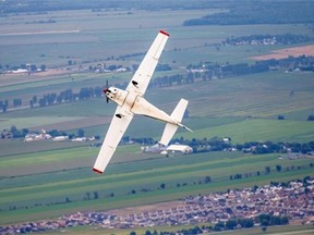 Michel Hamel performs a roll as he flies his plane with Gazette reporter François Shalom on board. Oddly, Shalom says, flying upside down is smooth and effortless.