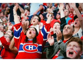 Montreal Canadiens fan Sajda Khan cheers a save by Habs goalie Carey Price while watching Game 7 of Stanley Cup series against the Bruins in Boston, on the big screens at the Bell Centre in Montreal Wednesday May 14, 2014.