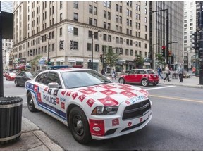 Montrealers are seeing more and more police cars plastered with stickers like this one as police and other public sector union workers protest a bill that would force them to pay more for their pensions.