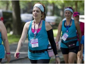 Cancer survivor Virginia Champoux particiates in a walk as part of the weekend to end breast cancer at Parc Lafontaine in Montreal on Saturday.