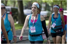 Cancer survivor Virginia Champoux particiates in a walk as part of the weekend to end breast cancer at Parc Lafontaine in Montreal on Saturday.