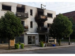 Montreal police are looking into what is described as a suspicious fire Monday night. The damaged building, in Lachine, on Tuesday, Aug. 5, 2014, is located at the corner of St Jacques St. and Ouellette St.