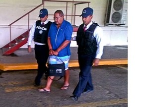 This photo taken on May 29, 2013 shows former MUHC executive director and Canadian spy watchdog Arthur Porter being detained by authorities in Panama City.