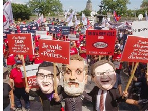 Union workers protest Bill 3 in Quebec City on Wednesday. One union leader scoffed at the idea of MNAs paying more into their own pensions.