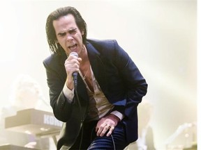 Australian musician Nick Cave performs for the 2014 Osheaga Music Festival at Jean-Drapeau Park in Montreal on Saturday. Gazette photo by Dario Ayala