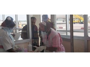 Nurses from Uganda’s Ministry of Health check passengers arriving from Democratic Republic of Congo, Central Africa, at Entebbe Airport Kampala Uganda on Friday.