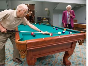 A Gazette reader is worried about her parents aging, having already seen their activity level dwindle. Pictured here are Mary Sancton and René Larose playing a game of pool at the Manoir Westmount residence for seniors, on May 29, 2012)