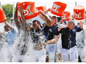 Tennessee Titans players take part in the Ice Bucket Challenge in Nashville on Aug. 20. One cannot help but notice that the majority of posts about the challenge on social media do not refer to ALS, Gary Armstrong writes.
