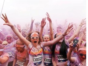 Participants dance at the end of the Colour Run around Wembley Stadium in London on June 1.