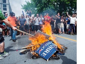 Public sector workers lit a bonfire as they protested against proposed pension changes in front of City Hall in June.