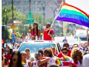 Revellers take part in the 2013 Gay Pride Parade in downtown Montreal on Sunday, August 18, 2013.