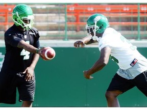 Saskatchewan Roughriders QB Darian Durant (L) with running back Jerome Messam (R) during riders practice at Mosaic Stadium in Regina on Thursday, Aug. 14, 2014.
