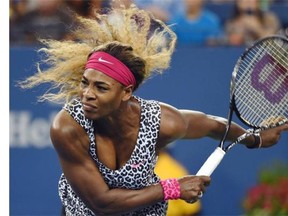 Serena Williams of the US serves to Taylor Townsend of the US during their US Open 2014 women’s singles match at the USTA Billie Jean King National Center August 26, 2014 in New York.