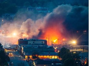 Smoke and fire rise over Lac-Megantic on Saturday, July 6, 2013.