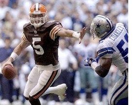 In this Sept. 19, 2004, file photo, Cleveland Browns quarterback Jeff Garcia (5) stiff-arms Dallas Cowboys linebacker Dexter Coakley in the third quarter of an NFL football game in Irving, Texas. Garcia, who was a four-time CFL all-star and an NFL Pro Bowler is joining the Als’ offensive coaching staff.