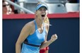 Maria Sharapova of Russia celebrates after beating Garbine Muguruza of Spain during second round of play at the Rogers Cup tennis tournament Wednesday August 6, 2014 in Montreal. )THE CANADIAN PRESS/Paul Chiasson)