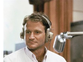 This 1987 file photo released by Touchstone Pictures shows actor Robin Williams in character as disc-jockey Adrian Cronauer in director Barry Levinsons comedy drama, Good Morning Vietnam. Williams, whose free-form comedy and adept impressions dazzled audiences for decades, has died in an apparent suicide. He was 63. The Marin County Sheriff’s Office said Williams was pronounced dead at his home in California on Monday, Aug. 11, 2014. The sheriff’s office said a preliminary investigation showed the cause of death to be a suicide due to asphyxia.