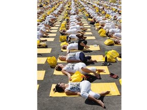 Six thousand people take part in a yoga for peace yoga session as part of the Lole White Tour held in the Old Port of Montreal in Montreal on Saturday August 9, 2014.