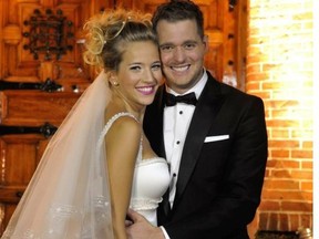 Canadian crooner Michael Buble and his bride, Argentine TV star Luisana Lopilato, posing after their wedding in Buenos Aires. After the religious ceremony the newlyweds offered a party for 300 in the outskirts of the Argentine capital.