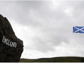 Views of the border between Scotland and England at Carter Bar on the A68 on August 17, 2014. A month to the day until Scotland votes on whether to split from Britain, opinion polls Monday showed the pro-independence camp gaining ground as First Minister Alex Salmond insisted his side had a “spring in their step”. But the polls still showed a strong lead for the ‘No’ camp ahead of the vote on September 18, suggesting voters are on course to reject independence. Debate in the campaign has so far focused on Scotland’s economy, particularly on the currency post-independence.