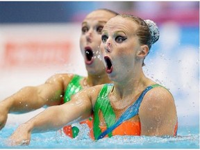 Wiebke Jeske and Edith Zeppenfeld from Germany perform during the duet synchronized swimming technical routine at the LEN Swimming European Championships in Berlin, Germany, Wednesday, Aug. 13, 2014.