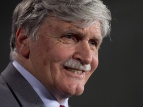 Senator Romeo Dallaire smiles as he answers a question on his retirement from the Senate during a news conference on Parliament Hill Wednesday May 28, 2014 in Ottawa. THE CANADIAN PRESS/Adrian Wyld