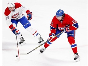 Alex Galchenyuk and P.A. Parenteau battle for the puck during a Montreal Canadiens Red-White intra-squad game at the Bell Centre in Montreal Monday, Sept. 22, 2014.