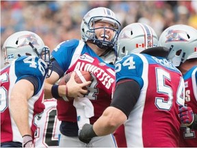 Alouettes’ quarterback Tanner Marsh celebrates with teammates Jean-Christophe Beaulieu (46) Jeff Perrett (54) and Ryan Bomben (64) after scoring a touchdown against the Calgary Stampeders in Montreal on Sunday.